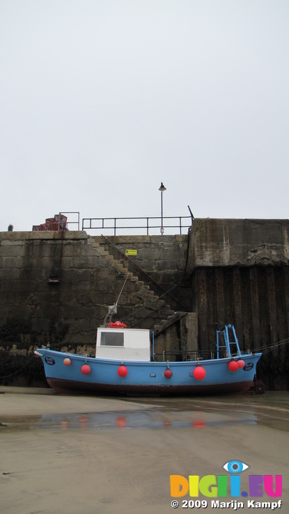SX08775 Small blue fishing boat in Newquay Harbour
